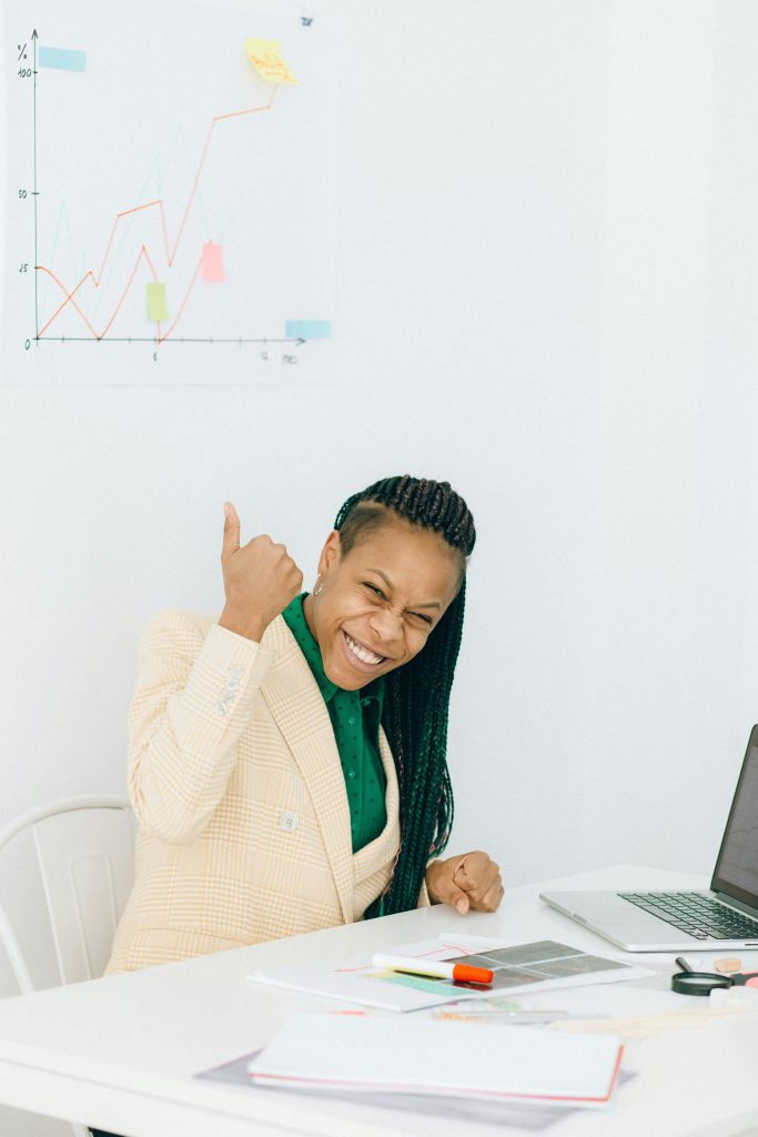 Young african lady doing thimbs up in an office settings