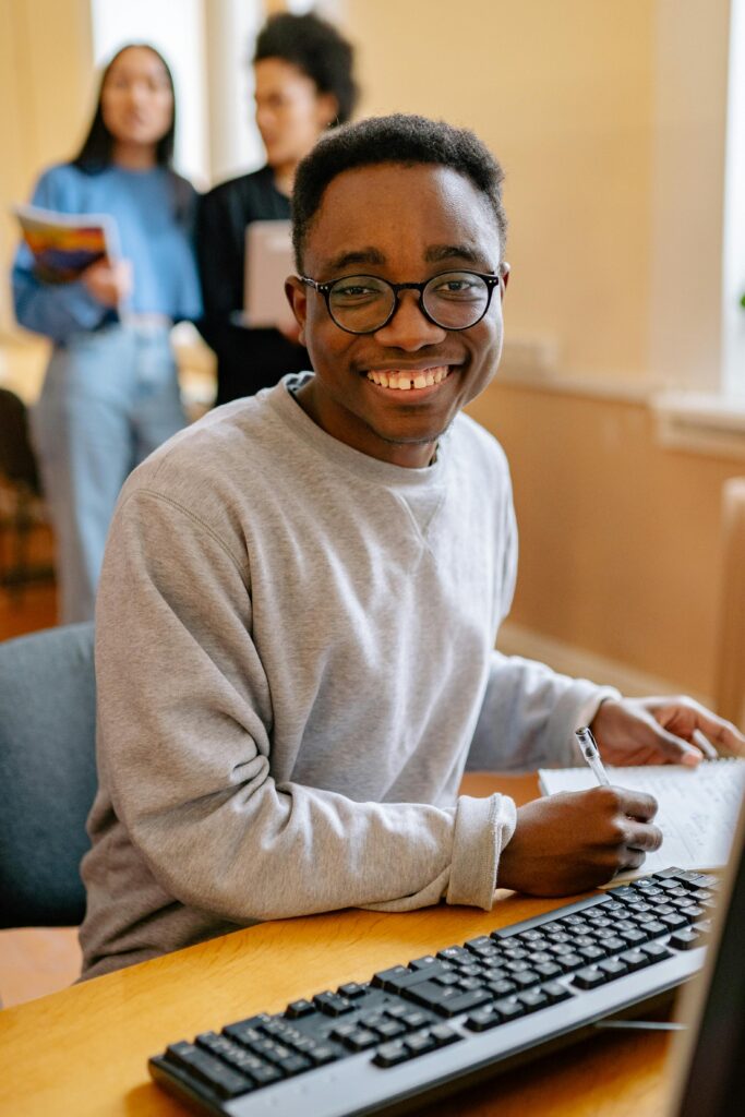 Young black man sitting at a desk